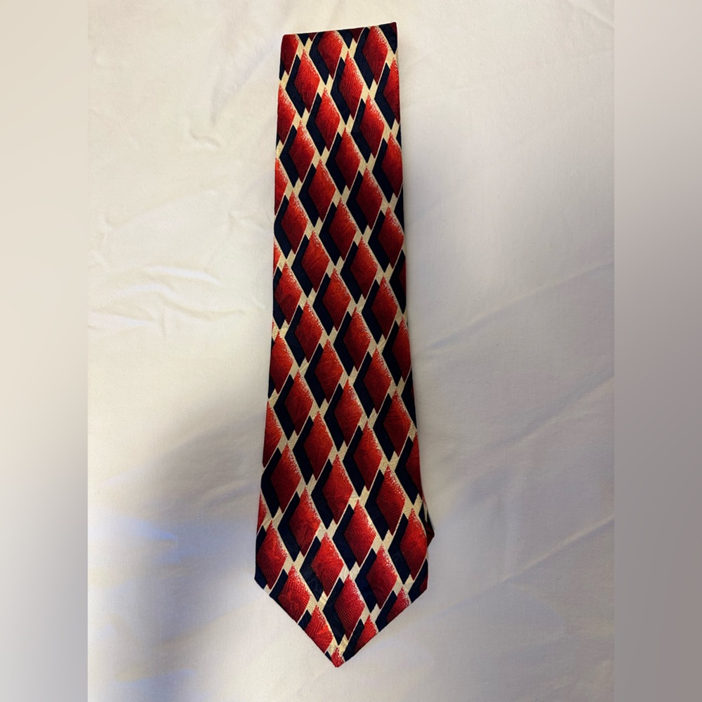 Neiman Marcus Silk Tie made in Spain Red and Navy geometric diamond pattern.